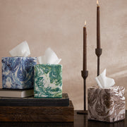 Balthazar marbled tissue box covers in blue, green, and brown with candles