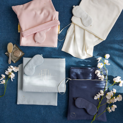 Dream Modal slumber sets in blush, ivory, and navy with silk sleep masks