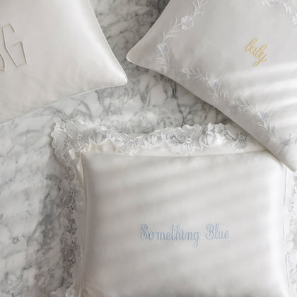 Silk Collection mini pillows in white with floral embroidery and script text