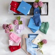 Cashmere sleeping socks in assorted colors with embroidered moon, heart, and star motifs