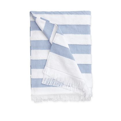 Blue Amado beach towel with a textured weave.