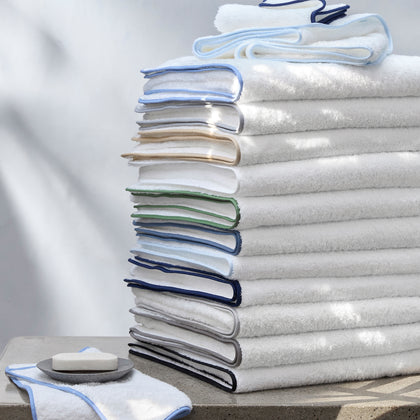 Stack of folded Cairo bath towels in white.
