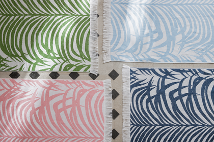 Zebra Palm beach towels in jungle green, pool blue, flamingo pink, and navy