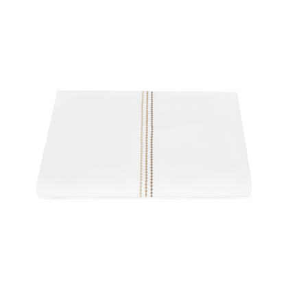 White Amara Triple Pearl duvet cover with tan ombre embroidered trim.