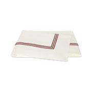 Ivory and red Bel Tempo Nocturne flat sheet, folded.