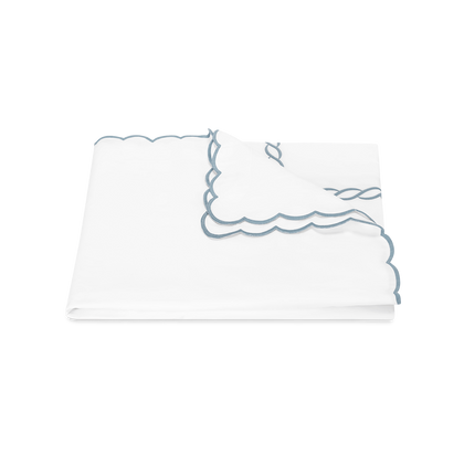 Hazy blue Classic Chain Scallop duvet cover, folded.