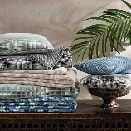 Jackson check coverlets and shams folded in multiple colors
