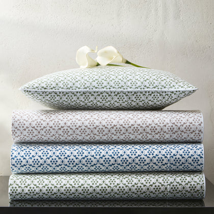 Laksha floral block-print sheets rolled with a matching pillow
