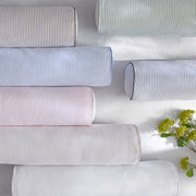 Matteo striped round bolster pillows in pastel colors with flowers