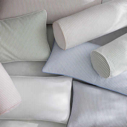 Matteo striped bolster and lumbar pillows in pastel colors arranged together