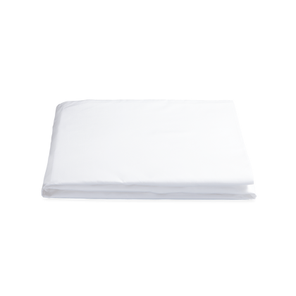 Milano fitted sheet in white, folded on a plain background