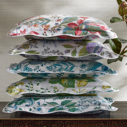 Stack of Pomegranate floral pillow shams in assorted colorways