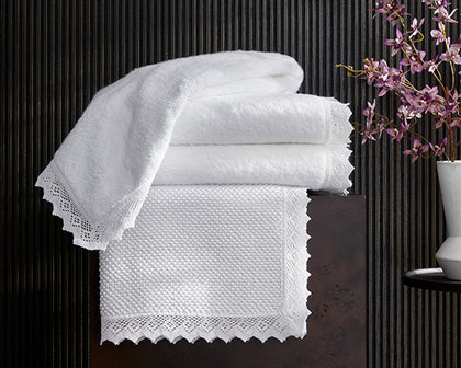 Stacked Ellis bath towels with crochet lace trim and floral styling