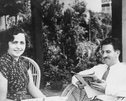 Archival photo of the Matouk family seated on a porch