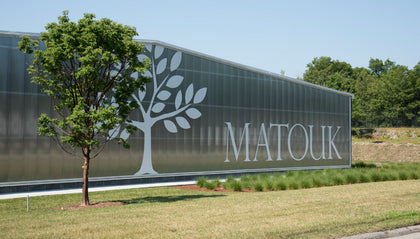 Exterior of the Matouk facility with tree logo signage