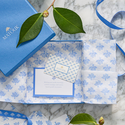 Matouk gift card in blue branded packaging with ribbon and a greeting card