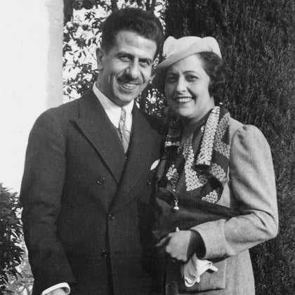 Black and white photo of Matouk's founders standing together outdoors