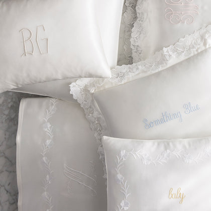 Silk Collection monogrammed pillowcases with lace trim and personalized script embroidery