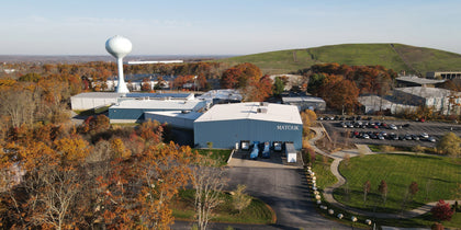 Aerial view of the Matouk facility surrounded by autumn trees