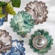 Balthazar scalloped cocktail napkins with marbled green, blue and brown print.