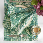 Balthazar green marbleized napkin folded on a matching placemat
