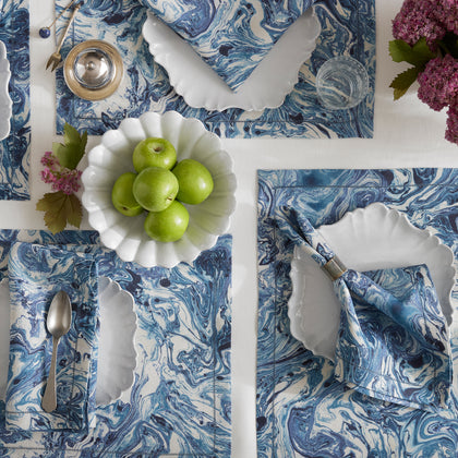 Balthazar blue marbleized table linens with a bowl of green apples