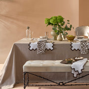 Iconic Leopard napkins in brown on a linen tablecloth table setting