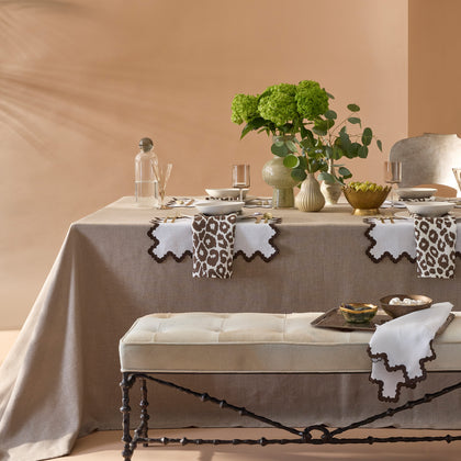 Iconic Leopard napkins in brown on a linen tablecloth table setting