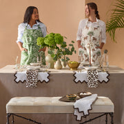 Two women at a table set with brown Iconic Leopard napkins