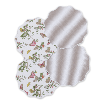Round reversible quilted placemats with pink Baudin butterfly print and striped reverse.