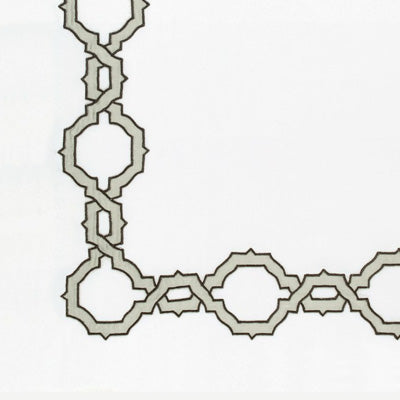 A close-up of a repeating geometric interlocking pattern in light gray on a white background.