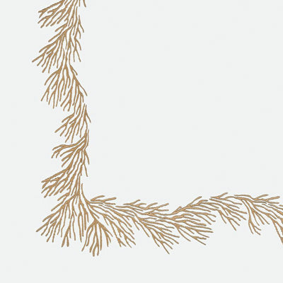 Close up of a napkin featuring a tan branch  along the top and left edges