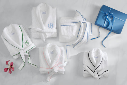 Assorted monogrammed Cairo robes with a gift box.