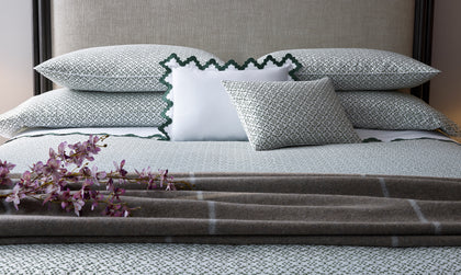 Laksha moss floral-print bedding with scalloped shams and a plaid throw