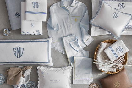 Assorted personalized monogrammed bedding, pillows and towels.