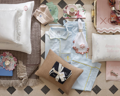 Assorted personalized gifts including a pillow, socks and throw.