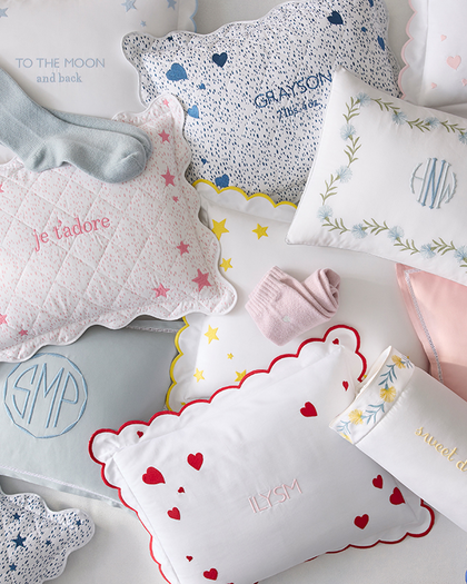 Assortment of personalized kids' pillows with embroidered names and monograms