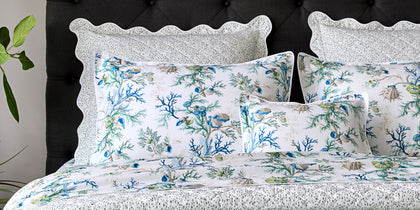 Print Shop spotlight card with coral and shell print bedding.