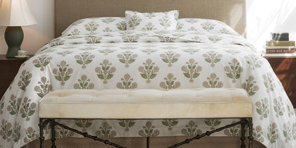 Dalila floral print styled in a green bedroom vignette.