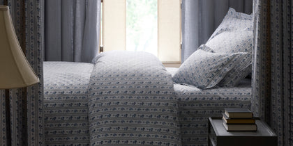 Cabanon Stripe print styled in a blue bedroom vignette.
