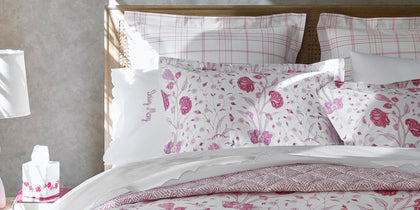 Khilana floral print styled in a pink bedroom vignette.