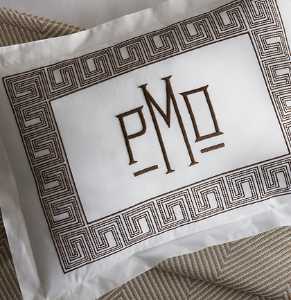 Monogrammed pillow with a brown Greek key embroidered border