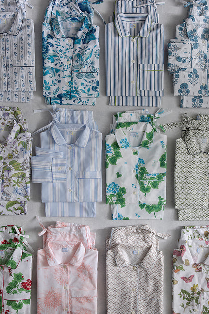 Schumacher pajama sets in assorted prints, folded.