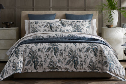 Apolline botanical bedding styled on a bed.
