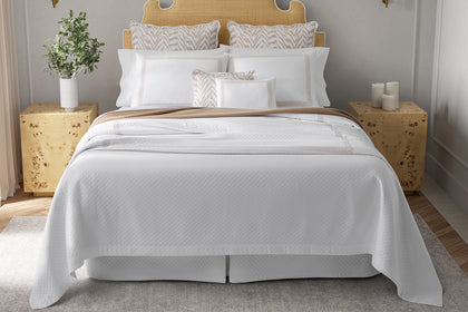 White Astor Braid Matelassé bedding styled on a bed.