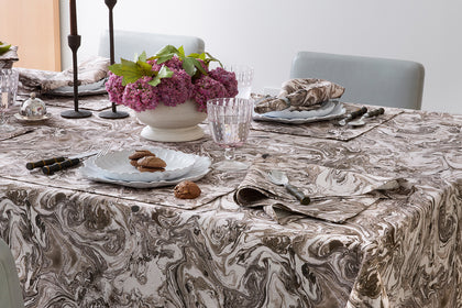 Balthazar marbled tablecloth set for a dinner party.