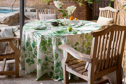 Green Citrus Garden tablecloth set poolside.