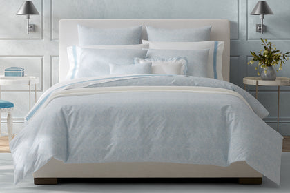 Pale blue Duma Diamond bedding styled on a bed.
