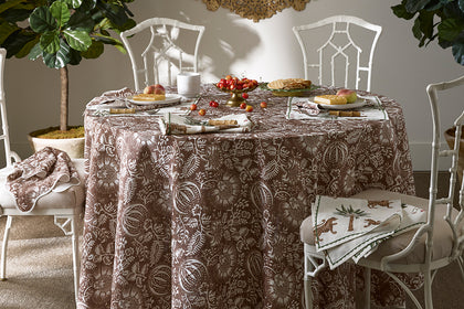 Granada pomegranate-print tablecloth set for a dinner party.