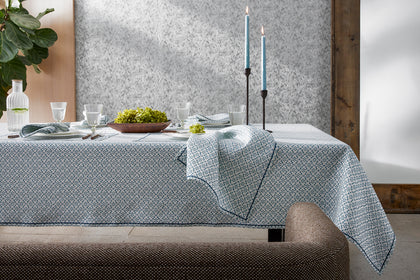 Laksha patterned tablecloth set for a dinner party.